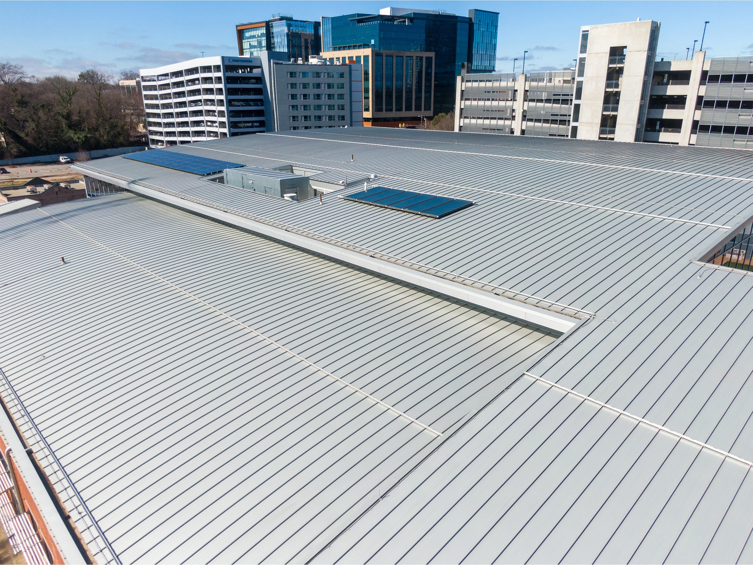 Finished commercial metal roof in an urban area