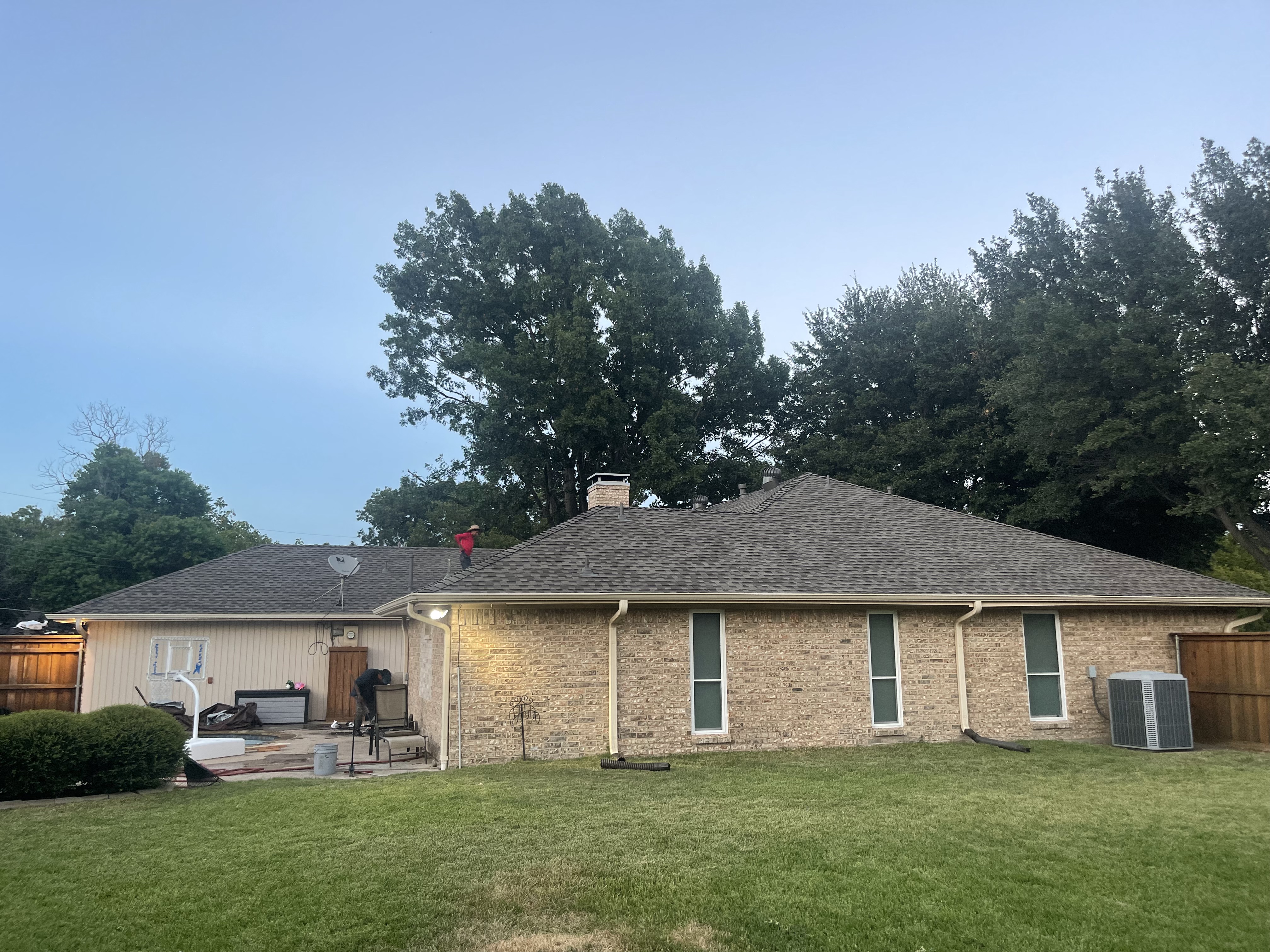 Roofing professional inspecting storm damage for insurance claim documentation
