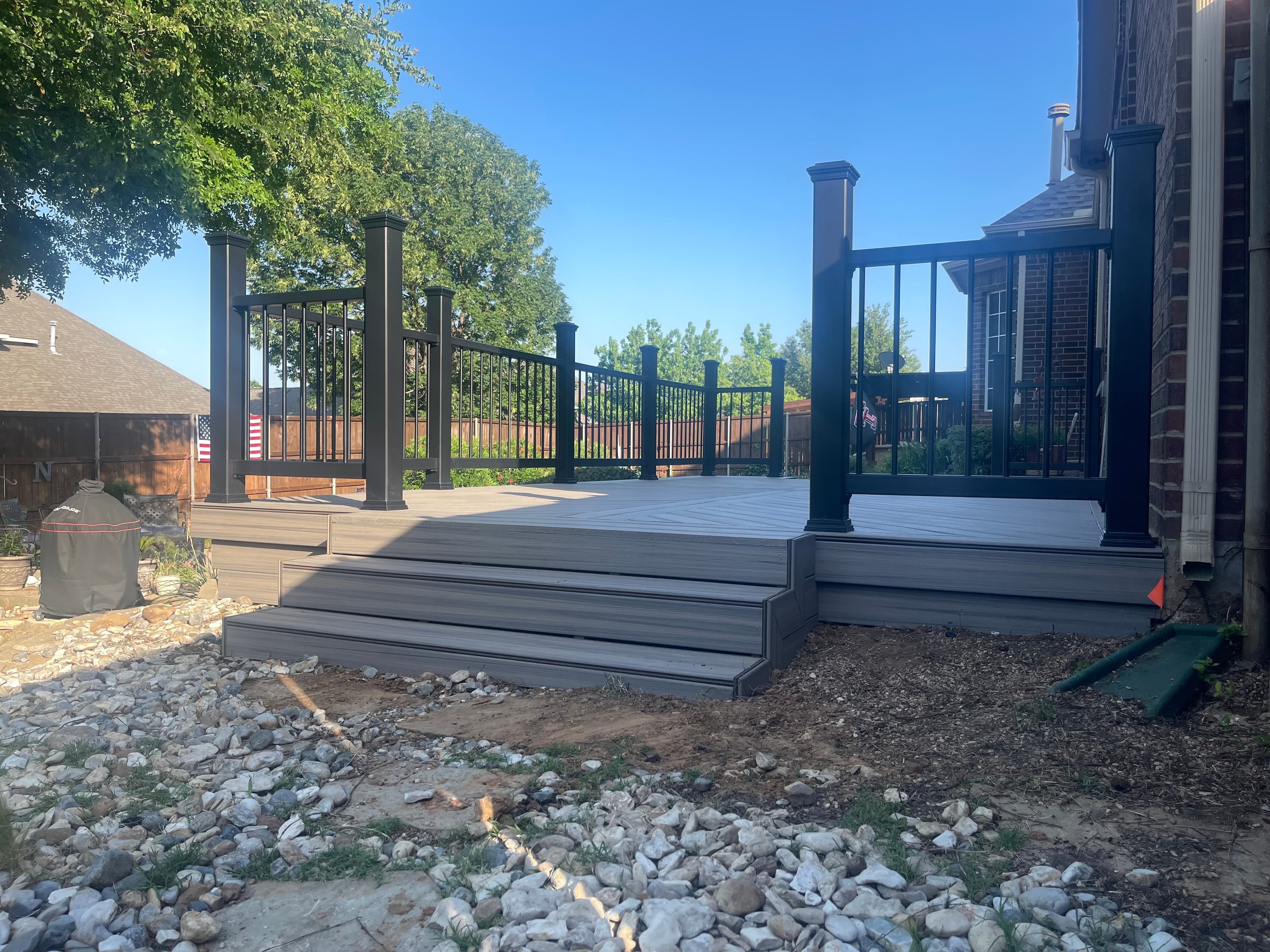 Composite deck with black metal railings